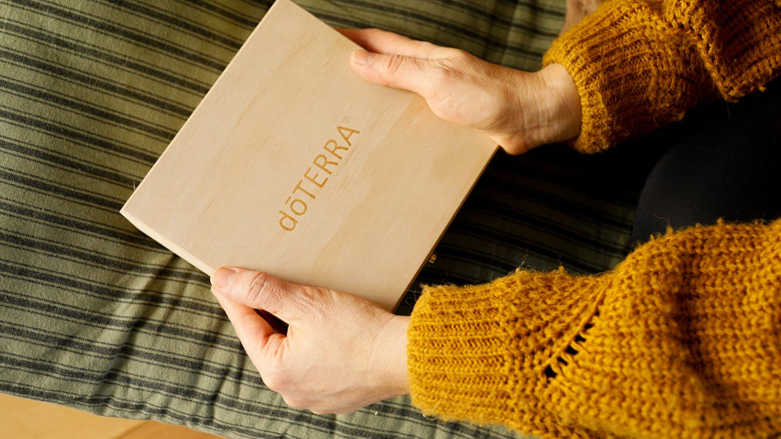 Hands opening a sealed dōTERRA box